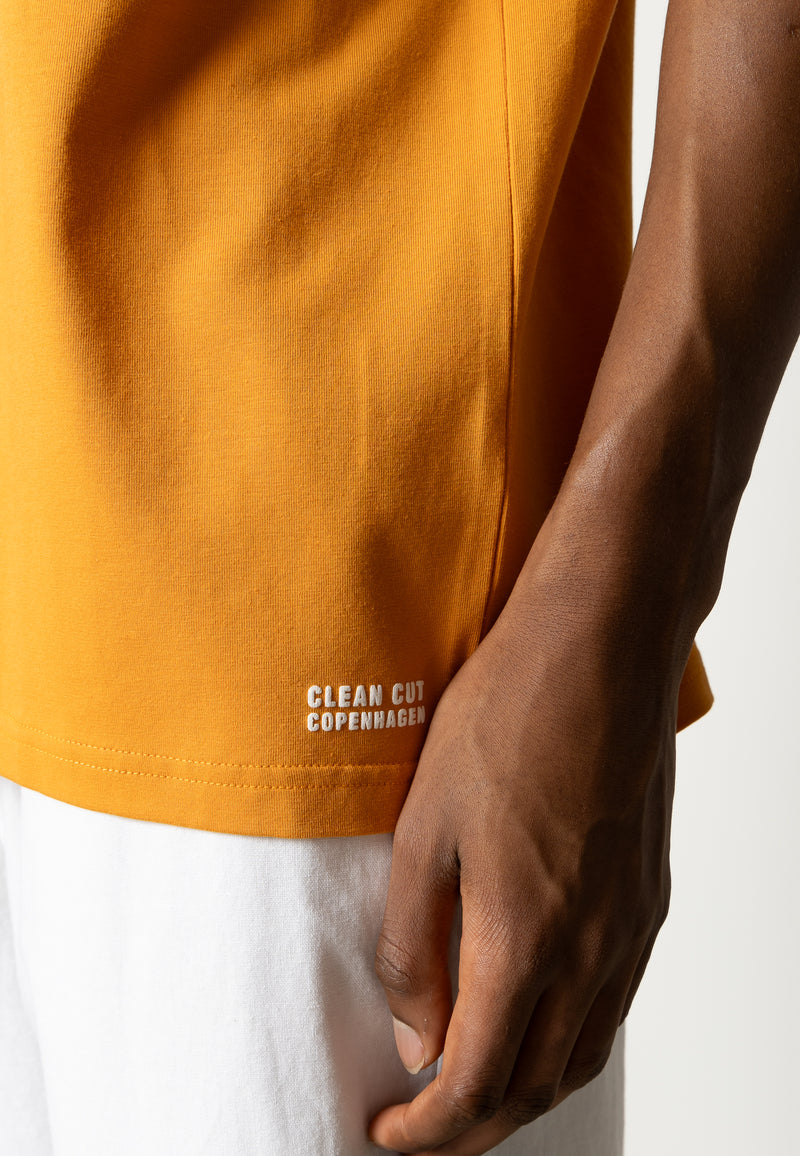 Clean Cut Copenhagen Cross logo organic t-shirt T-shirts S/S Orange